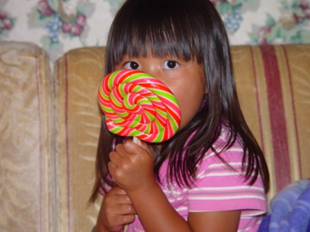 Kasen eating a huge lollipop